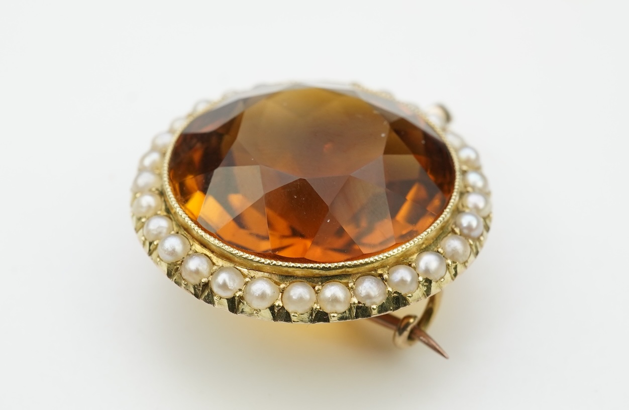 An Edwardian citrine and pearl brooch/pendant, early 20th century